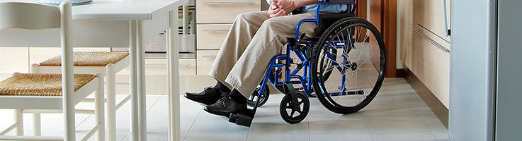 man in wheelchair in a kitchen