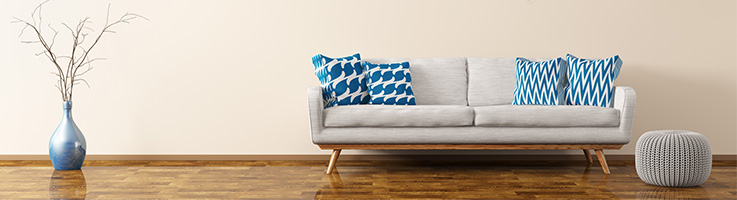 living room with hard wood flooring and light gray colored couch