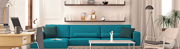 living room with bright blue couch and dark brown shelving