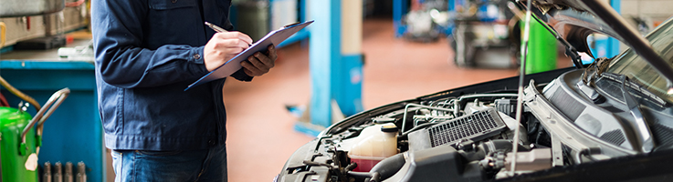 mechanic checking car