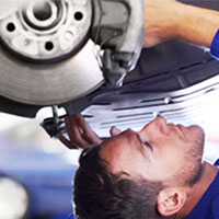 mechanic working under car