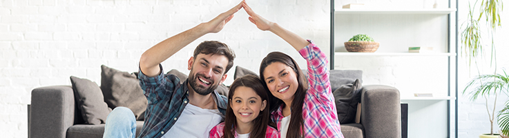 mom and dad creating roof over daughter