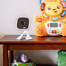 wireless security camera on table with children's toys