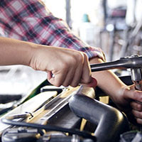 mechanic fixing car engine