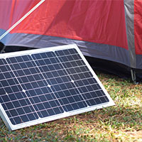 portable solar panels outside a camping tent