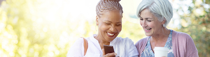 two older women looking at cellphone