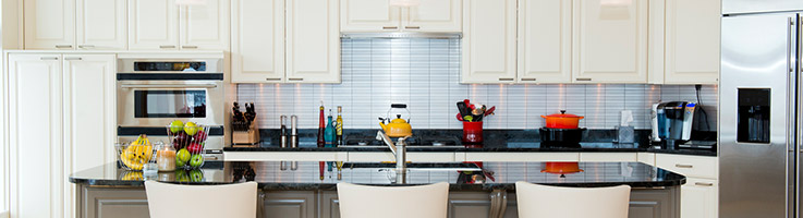 large white kitchen with dark island