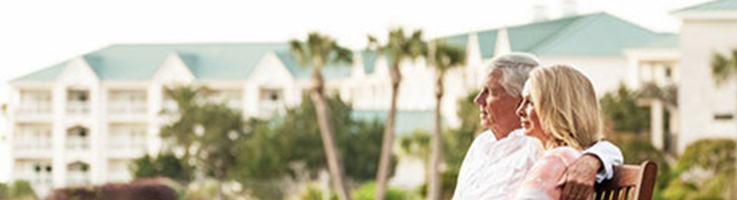 older couple looking at the beach