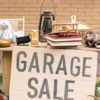 household and personal items for sale displayed outside home