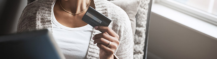 woman holding credit card