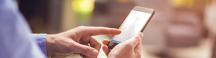 person using app for smart home technology