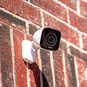 vivint outdoor camera attached to a brick wall