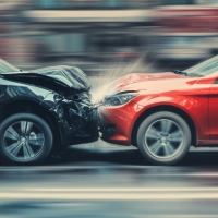 a black and red car colliding