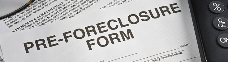 preforeclosure form with pen and calculator