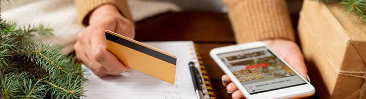 woman christmas shopping with credit card