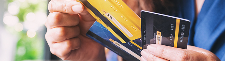 woman holding credit cards