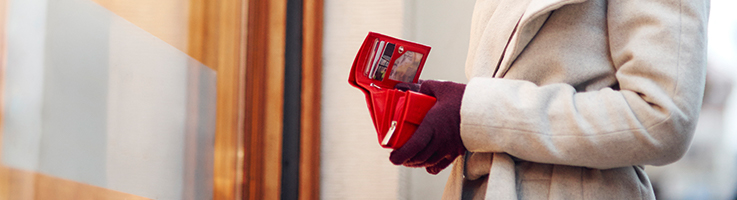 woman opening wallet