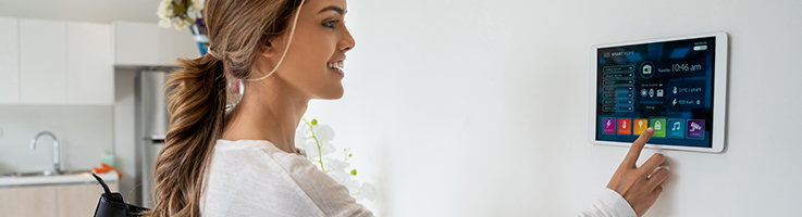 woman using smart security panel