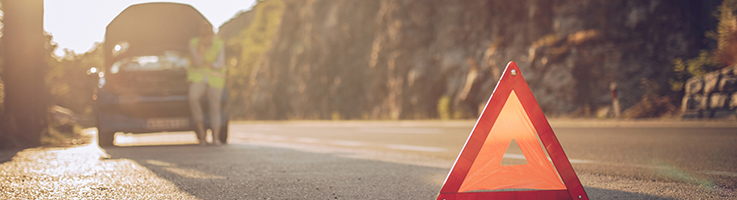 woman with car trouble on side of road
