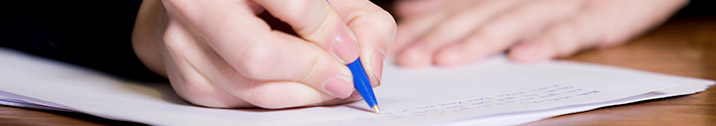 Person writing on paper