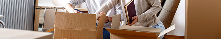 Couple unpacking boxes