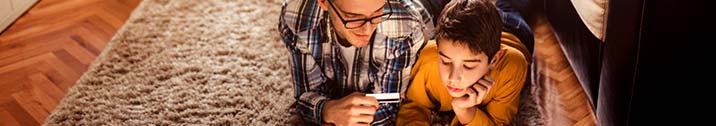 Father teaching kid about credit