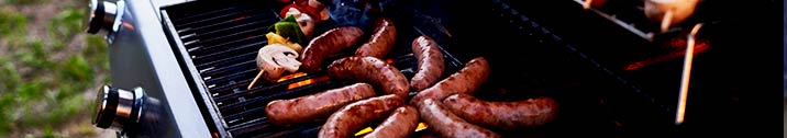 Brats grilling on a grill