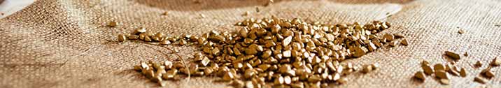 Gold pebbles on burlap cloth