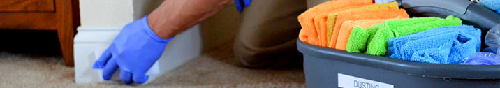 Man washing baseboards