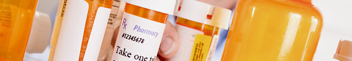 Orange pill bottles on shelf
