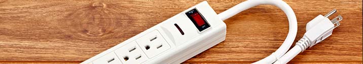 Power strip on wooden floor