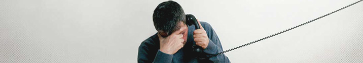 Sad man on telephone
