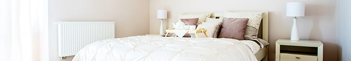 Small bedroom with white lamps