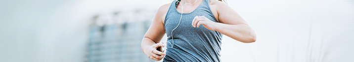 Woman running with headphones in