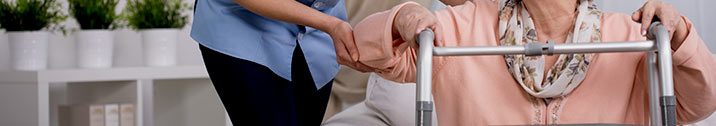 Woman using walker to stand up