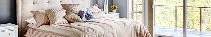 Bed with tan blanket