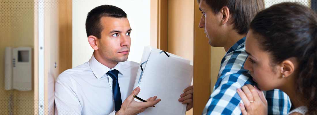 Couple meeting with bill collector
