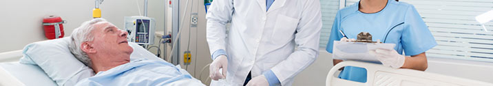 Doctors checking on senior patient