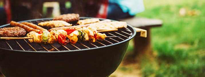 Food cooking on charcoal grill outside