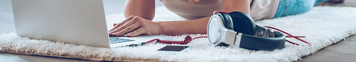 Girl on laptop with headphones