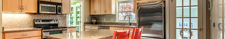 New granite kitchen with coral chairs