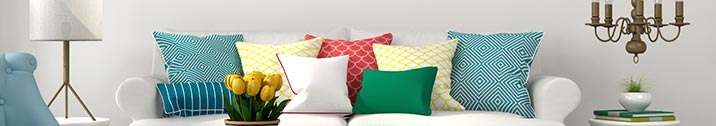Living room with white couch and colorful pillows