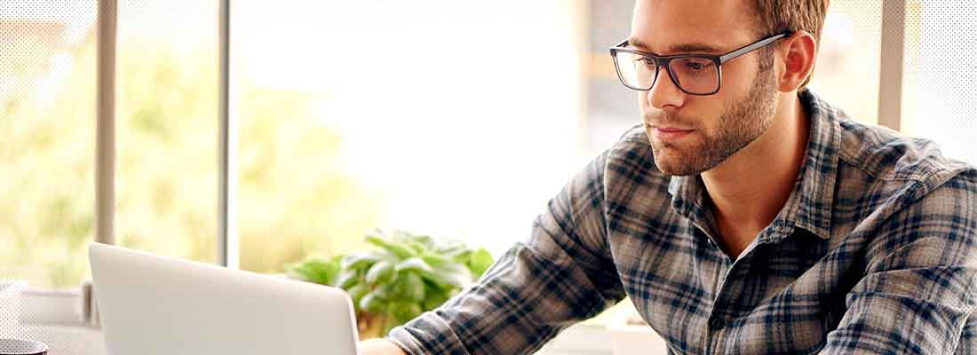 Man researching on laptop