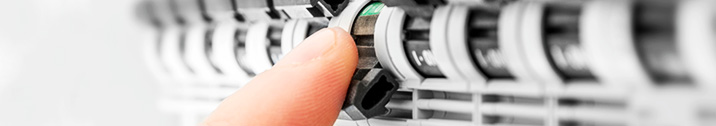 Person flipping breaker