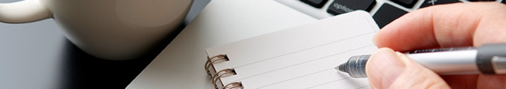 Person writing in notebook