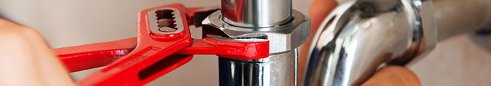 Plumber fixing pipe