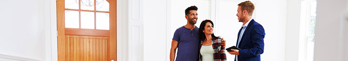 Realtor showing couple new home