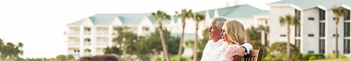 Senior couple in tropical retirement community