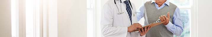 Senior patient talking to doctor