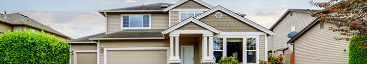 Tan house with white trim
